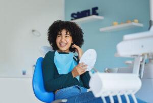 Girl in dental chair smiling