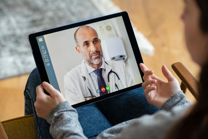 Physician conducts telehealth visit via the patient's tablet.